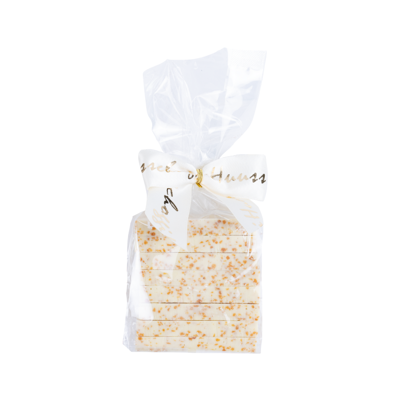 Huusschoggi im Säckli weiss mit Mandeln & Zimt (150g) Huusschoggi im Säckli weiss mit Mandeln & Zimt (150g)